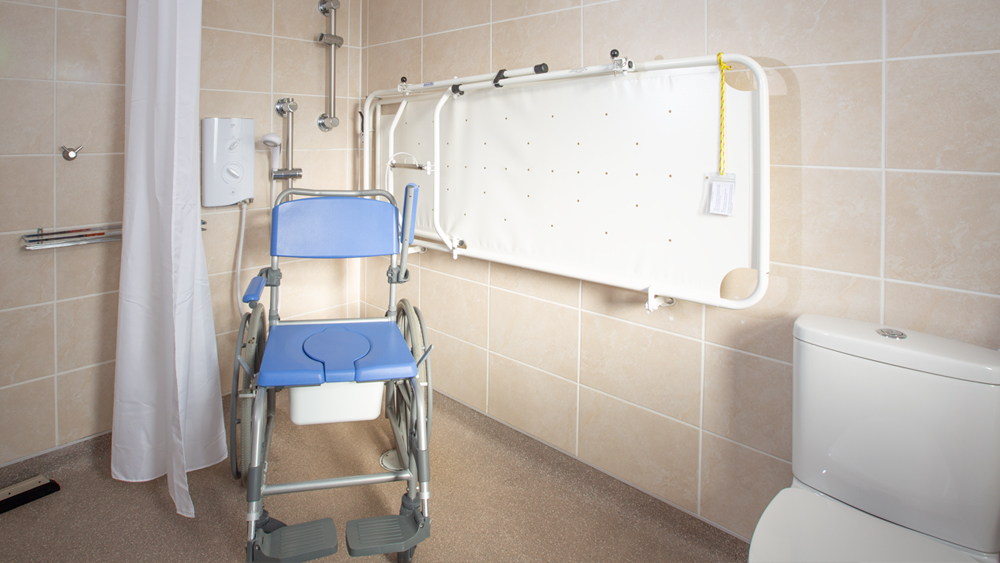 Accessible Wet Room with choice of optional shower chairs and changing stretcher